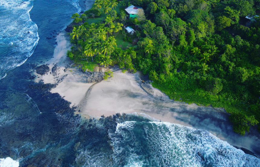 Drone view of a little white sandy beach in the Pacific coast of Costa Rica, near Junquillal